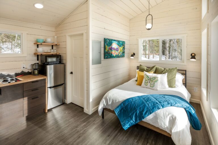 Bedroom and bathroom view inside Ranger's Roost, Bashful & Hideaway cabins.