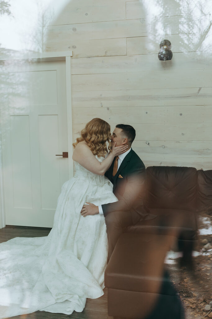 Bride and groom sitting together during their wedding weekend at Bluewater Basecamp in Alaska. Photo credit: Rachel Struve Photography
